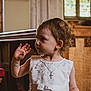Skylar-Rose joined the competition — help win amazing prizes! toddler, child, white_dress, lace, cross_necklace, curly_hair, indoor, church, stained_glass, wooden_bench, gesture, portrait, side_profile, cute, young_child, formal_clothing, people, person, baby, innocence