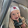 Giada is registered to the contest to win money with this photo: baby, smiling, car_seat, hat, infant, child, seat_belt, clothing, happy, cute, face, person, indoor, safety, seat, straps, young_child, headwear, closeup, baby_girl