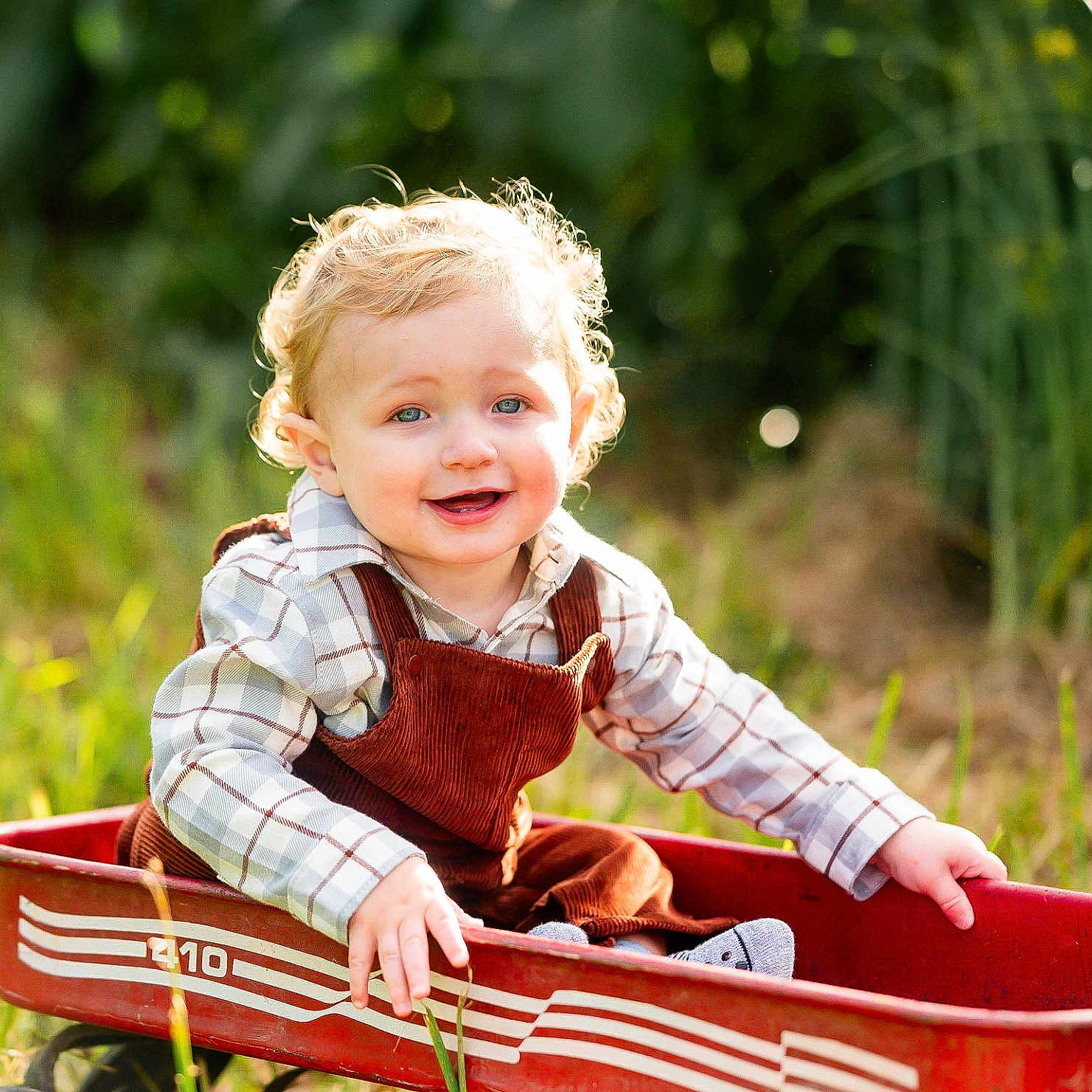 Mylo joined the competition — help win amazing prizes! baby, boat, bodypart, clothing, face, finger, footwear, grass, hand, happy, head, person, photography, plant, portrait, shoe, sitting, smile, transportation, vehicle