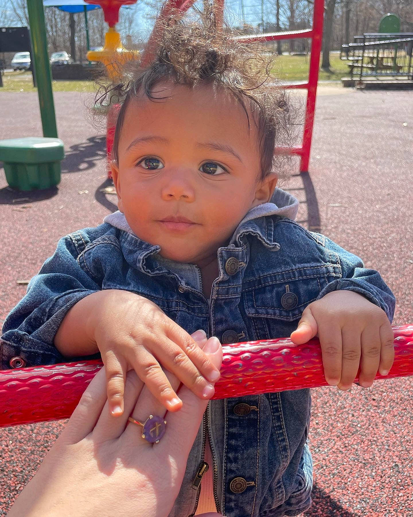 Skyler-ray is registered to the contest to win money with this photo: child, city, facial_expression, fun, grass, happy, leisure, outdoor_play_equipment, pattern, person, play, playground, recreation, sitting, skin, soil, spring, thumb, toddler, tree