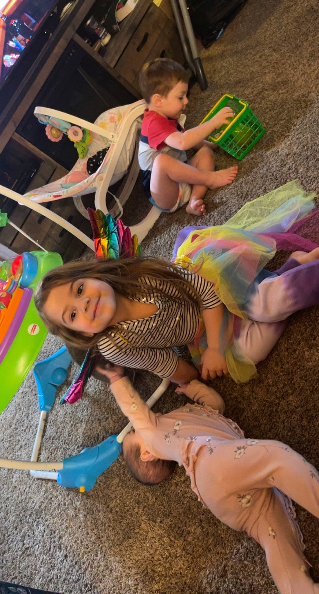 Anastasia is registered to the contest to win money with this photo: barefoot, child, event, foot, fun, green, happy, human_leg, joy, leisure, party, person, play, recreation, room, sandal, shorts, sitting, smile, t_shirt