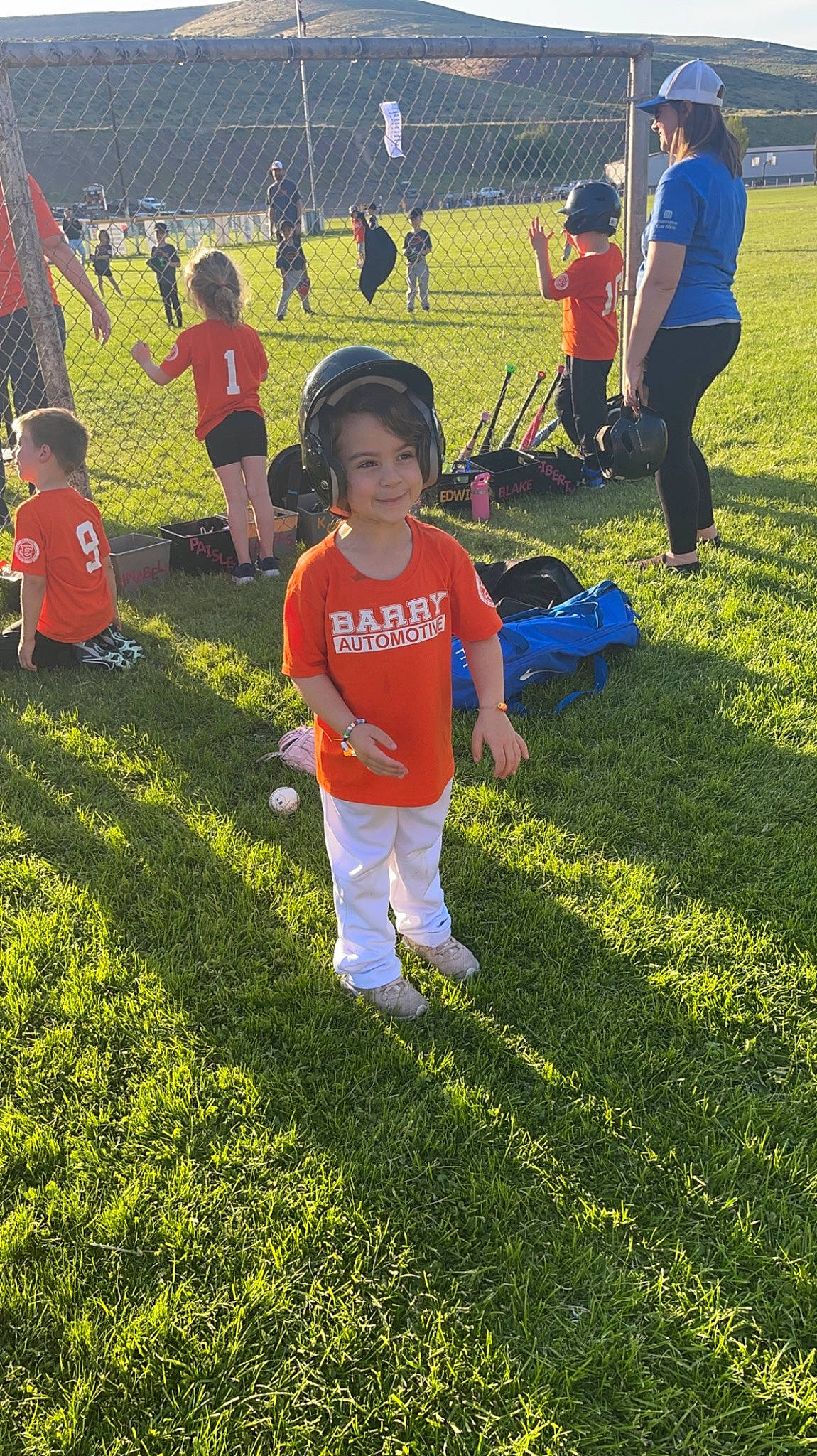 Anastasia is registered to the contest to win money with this photo: chair, competition_event, fun, grass, grass_family, grassland, groundcover, happy, joy, lawn, leisure, people_in_nature, person, player, recreation, shadow, shorts, sports, t_shirt, team