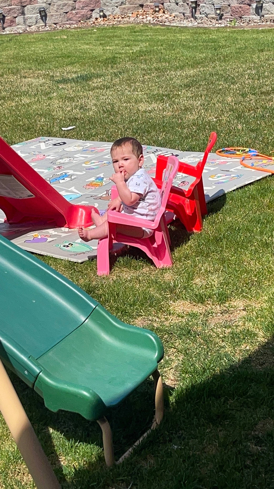 Alaina joined the competition — help win amazing prizes! automotive_exterior, baby, baby_toddler_clothing, bumper, chair, child, comfort, fun, grass, leisure, magenta, motor_vehicle, outdoor_furniture, person, plant, play, recreation, sitting, toddler, vehicle