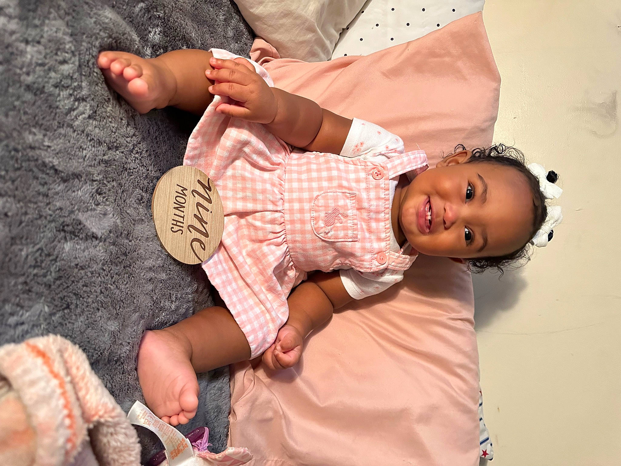 Harmoni is registered to the contest to win money with this photo: baby, baby_toddler_clothing, child, dress, finger, foot, fun, glasses, hand, happy, hat, human_leg, joy, leg, nail, pattern, person, pink, skin, smile