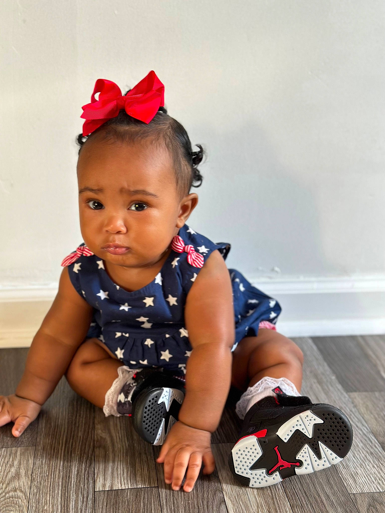 Harmoni joined the competition — help win amazing prizes! baby, baby_toddler_clothing, child, electric_blue, fashion_accessory, flooring, fun, hair_accessory, happy, hardwood, headband, jewellery, pattern, person, sitting, skin, sleeve, sock, toddler, wood