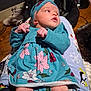 Liliana is registered to the contest to win money with this photo: baby, infant, child, floral_dress, headband, person, lap, pajamas, penguin_pattern, wooden_floor, shoes, indoor, cozy, cute, newborn, clothing, pattern, relaxing, human, portrait