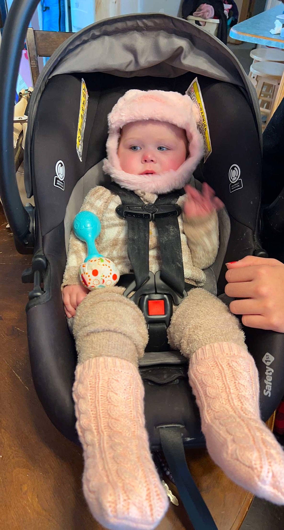 Lindsey is registered to the contest to win money with this photo: auto_part, baby, baby_carriage, baby_products, baby_safety, bag, blurred, car_seat, child, comfort, fashion_accessory, fun, fur, headwear, lap, person, product, sitting, toddler, white
