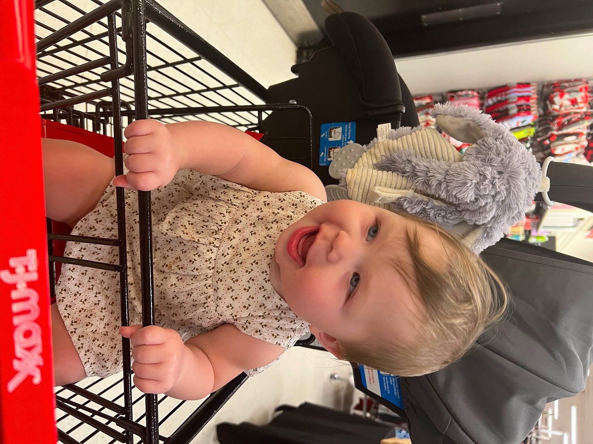 Lindsey is registered to the contest to win money with this photo: baby, beanie, cap, car_seat, child, engineering, fashion_accessory, fun, knit_cap, leisure, luxury_vehicle, person, personal_protective_equipment, play, room, smile, toddler, vacation