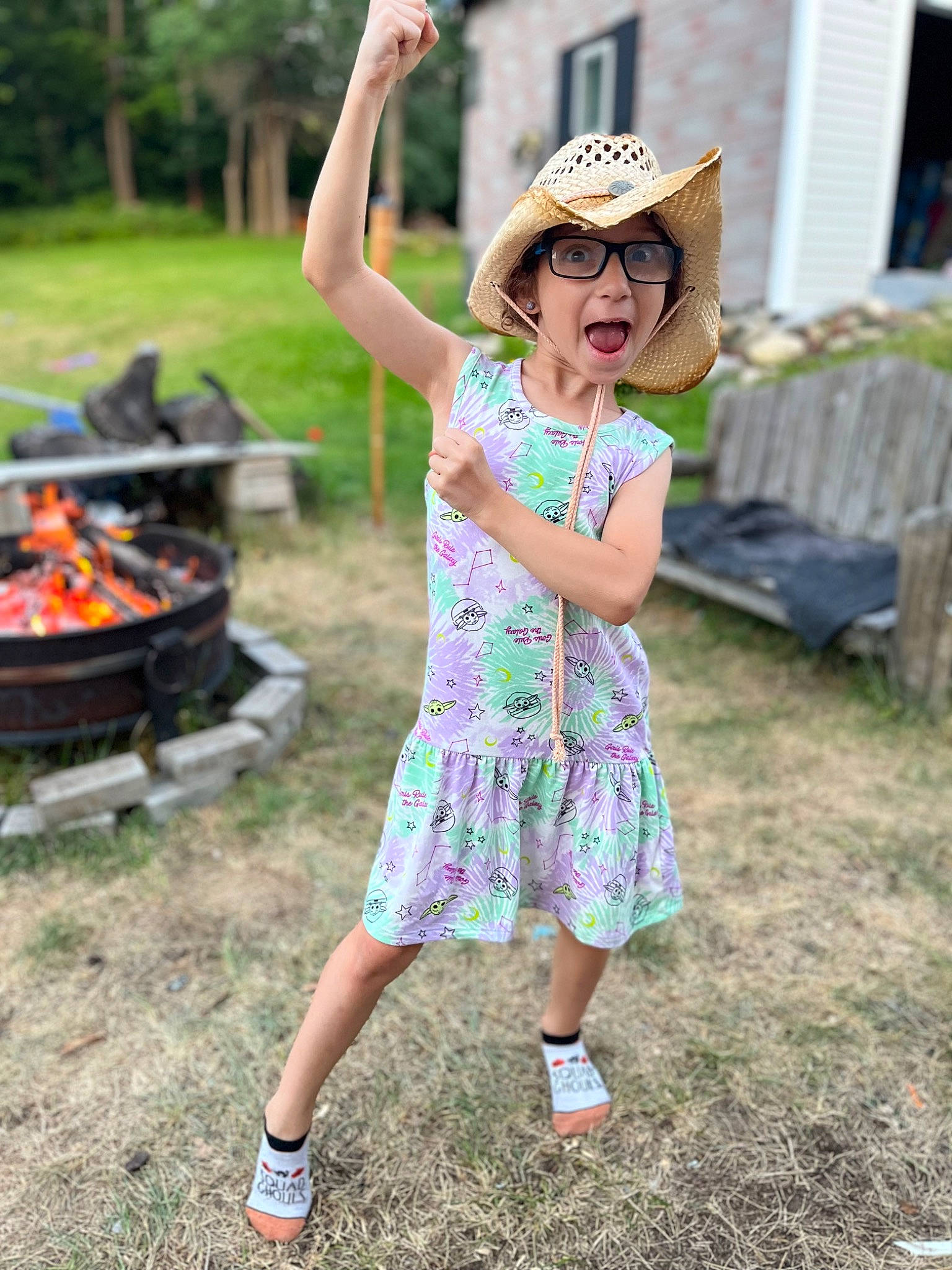 Emma is registered to the contest to win money with this photo: baseball_cap, cap, eyewear, face, fun, glasses, grass, hand, happy, hat, headwear, landscape, lawn, leisure, person, plant, recreation, sneakers, summer, sun_hat