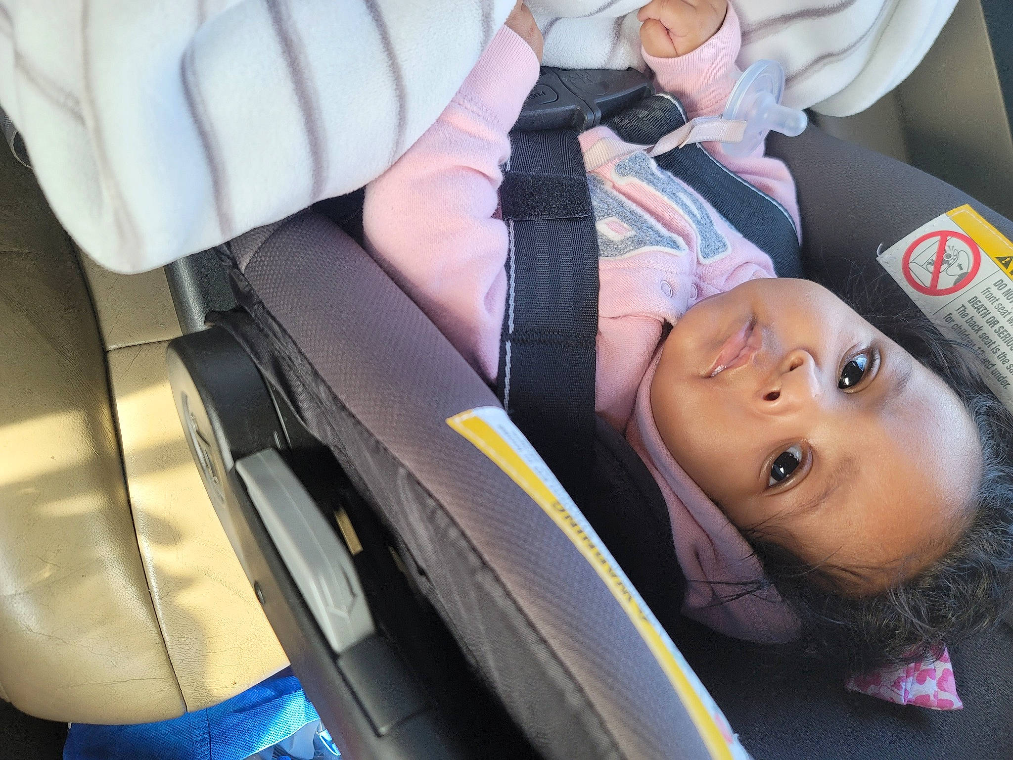 Selassie is registered to the contest to win money with this photo: auto_part, automotive_design, automotive_tire, automotive_wheel_system, baby_carriage, car_seat, car_seat_cover, child, comfort, family_car, head_restraint, luxury_vehicle, motor_vehicle, person, seat_belt, tie, tire, toddler, vehicle, vehicle_door