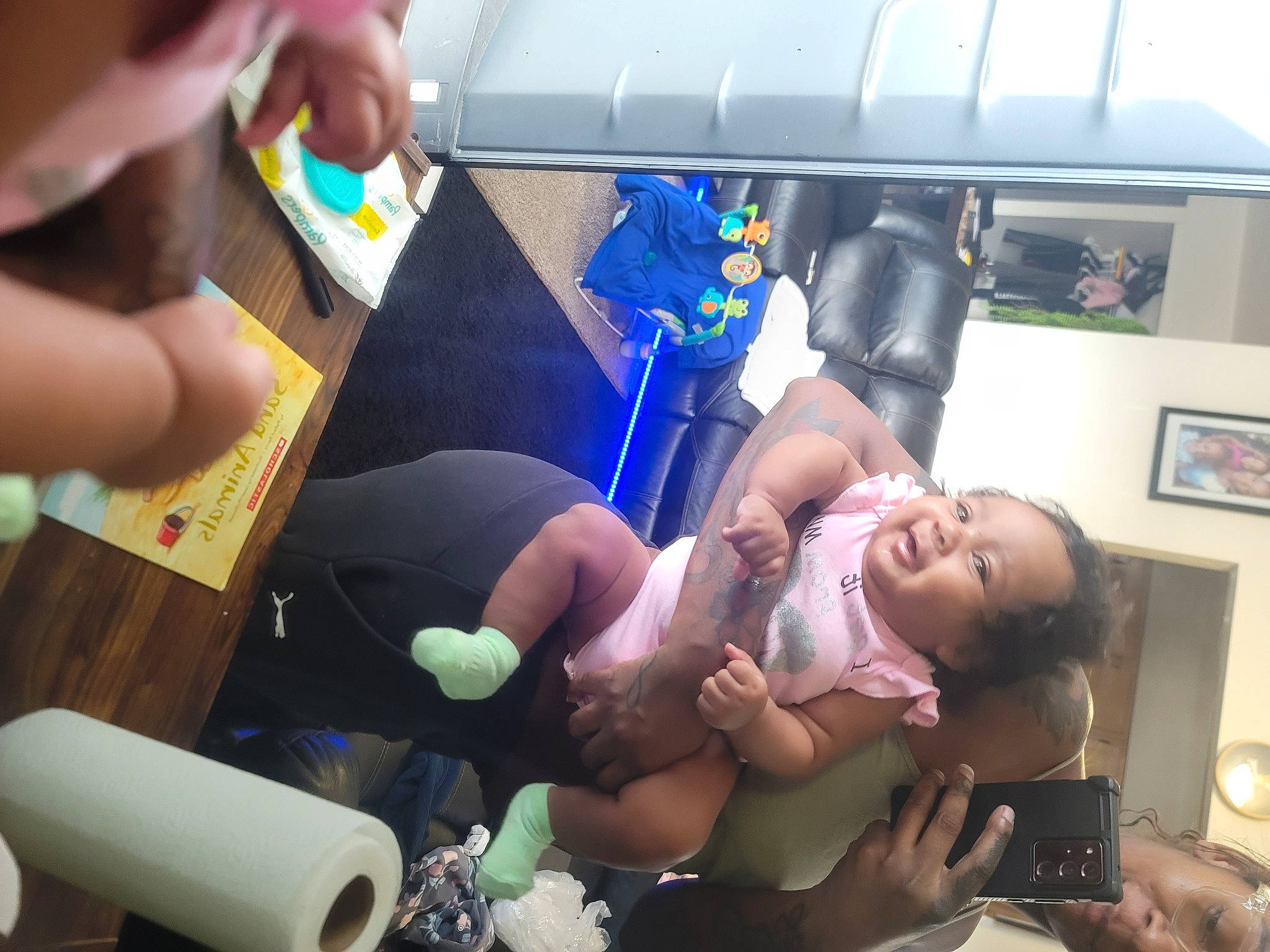 Selassie is registered to the contest to win money with this photo: abdomen, baby, baby_products, child, event, finger, fun, hand, happy, leisure, medical_equipment, medical_procedure, nail, person, picture_frame, plastic, room, smile, thigh, thumb