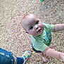 Alexander is registered to the contest to win money with this photo: toddler, child, barefoot, playground, wood_chips, green_shirt, shorts, curious, reaching, person, footwear, jeans, ripped_jeans, colorful_shoe, outdoor, daylight, play_equipment, casual_clothing, portrait, close_up