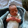 Mateo joined the competition — help win amazing prizes! newborn, baby, infant, blanket, bed, medical_tape, tube, clothing, white_onesie, hands, face, sleepy, cozy, soft, indoors, person, cute, resting, young_child, hospital