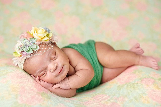 Aliza joined the competition — help win amazing prizes! baby, baby_sleeping, child, crown, hair_accessory, headband, headgear, headpiece, person, photograph, photography, pink, plant, skin, toddler, yellow