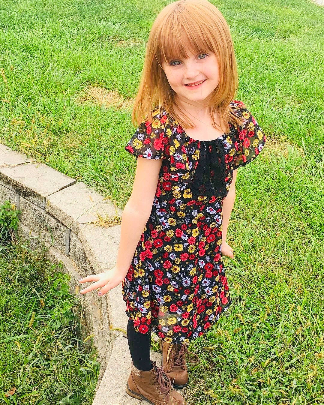 Kayleen is registered to the contest to win money with this photo: blond, child, child_model, clothing, design, dress, footwear, grass, grass_family, hair, joy, leggings, long_hair, pattern, person, plant, shoe, sleeve, summer, t_shirt