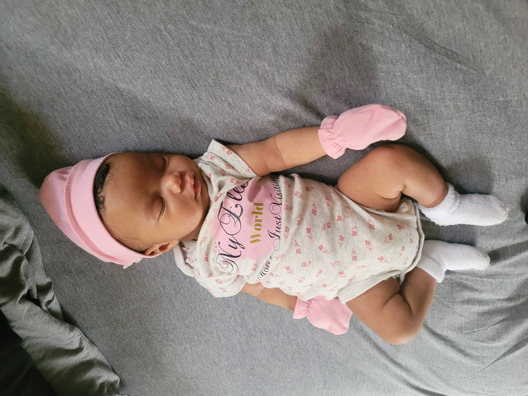 Nyelle is registered to the contest to win money with this photo: baby, baby_products, baby_toddler_clothing, cheek, child, comfort, finger, foot, gesture, hand, leg, mammal, person, pink, product, skin, sleeve, textile, thumb, toddler