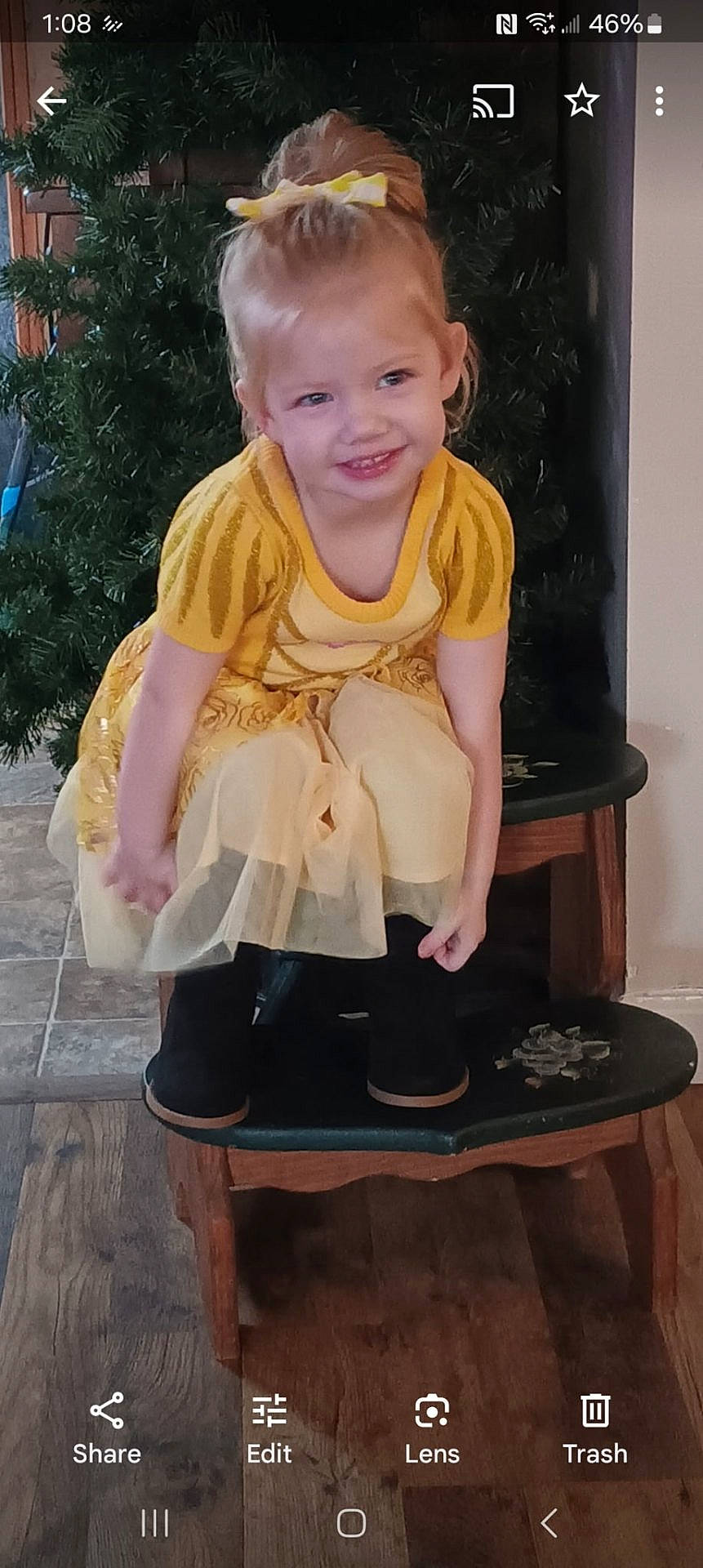 Lucy joined the competition — help win amazing prizes! child, clothing, costume, dress, face, female, footwear, furniture, girl, happy, head, pants, person, photography, plant, portrait, pottedplant, sandal, shoe, wood