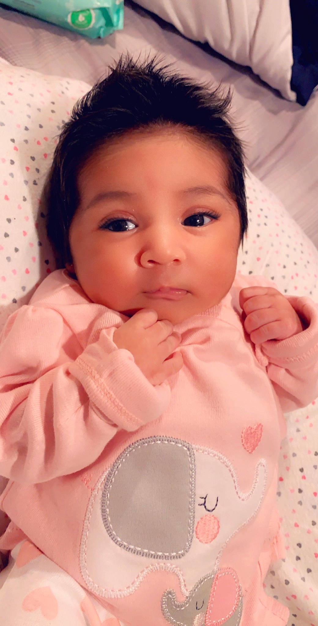 Anabella is registered to the contest to win money with this photo: baby, beauty, black_hair, brown_hair, cheek, child, eye, eyebrow, face, forehead, head, iris, lip, nose, person, pink, skin, smile, textile, toddler