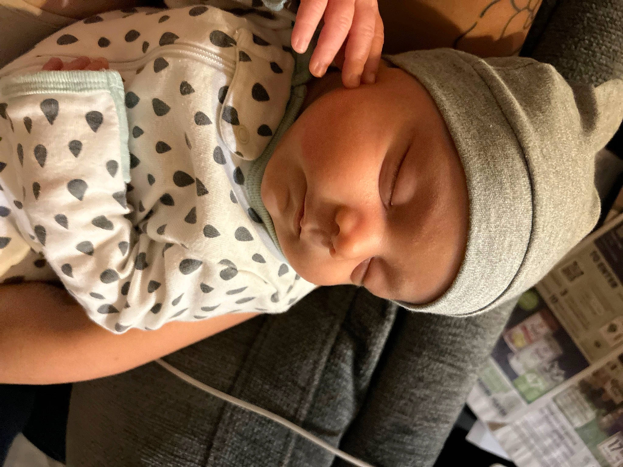 Gage is registered to the contest to win money with this photo: baby, baby_toddler_clothing, beanie, child, collar, comfort, elbow, eye, eyelash, headwear, human_leg, knit_cap, linens, neck, nose, pattern, person, portrait_photography, sitting, sleeve