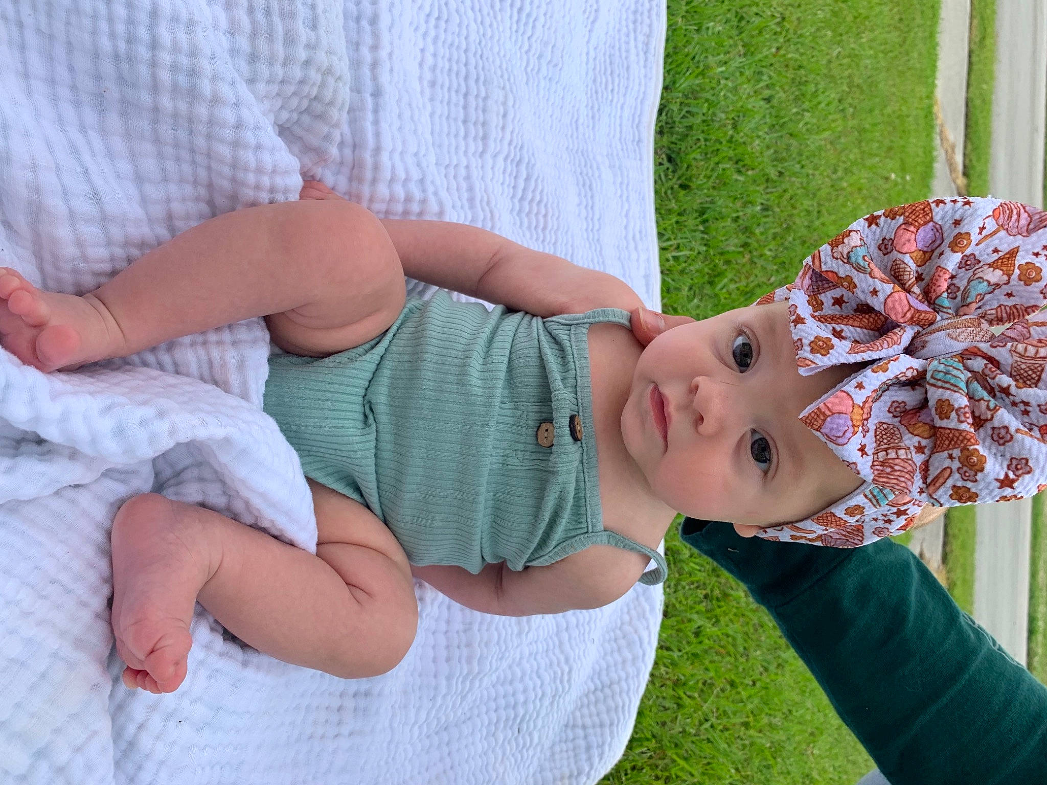 Lucia joined the competition — help win amazing prizes! baby_toddler_clothing, child, event, eyewear, face, fun, grass, green, happy, hat, head, headpiece, headwear, human_leg, leisure, pattern, people_in_nature, person, recreation, thigh