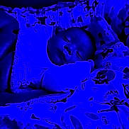 Evann participe au concours pour gagner de l'argent avec cette photo : baby, sleeping, blanket, bed, pillow, blue_light, infant, cozy, peaceful, child, soft_texture, patterned_blanket, indoors, cute, rest, portrait, sleepwear, comfort, young, face