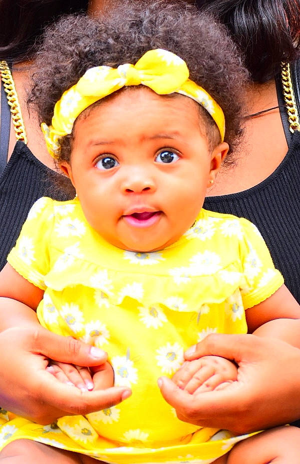 Aaliyah joined the competition — help win amazing prizes! baby, baby_toddler_clothing, cheek, chin, face, facial_expression, fun, green, hairstyle, happy, head, headwear, human, iris, lip, mouth, nose, orange, organ, person