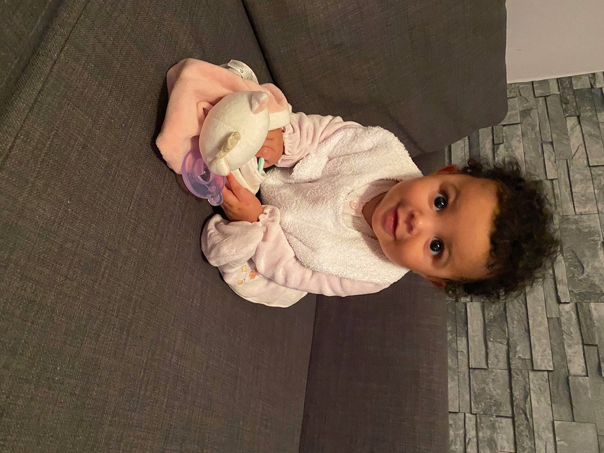 Aliyah participe au concours pour gagner de l'argent avec cette photo : baby, baby_toddler_clothing, cheek, child, chin, comfort, eye, face, flooring, gesture, happy, hat, human_body, nose, person, sitting, skin, sleeve, smile, toddler