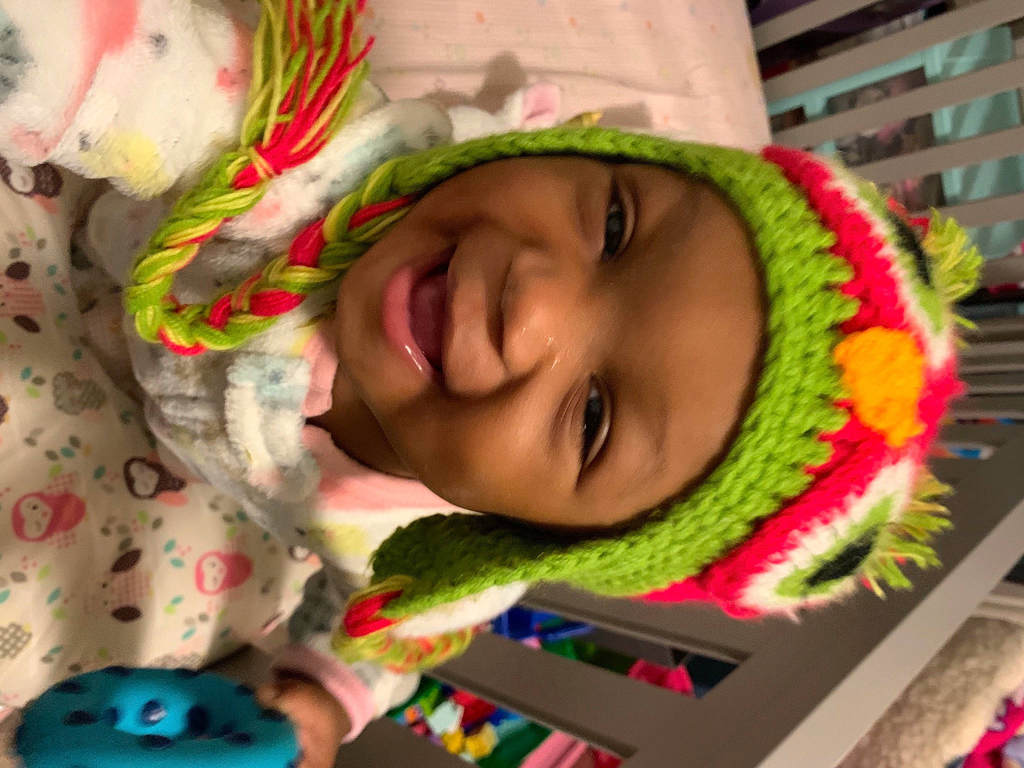 Khloe joined the competition — help win amazing prizes! baby_toddler_clothing, bonnet, cheek, facial_expression, green, headgear, headwear, knitting, laugh, person, photography, textile, thread, wool, woolen