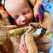 Raelynn is registered to the contest to win money with this photo: baby, sleeping, blanket, cozy, smile, face, child, infant, soft, closeup, warmth, comfort, rest, peaceful, wrapped, cute, portrait, indoor, newborn, toddler