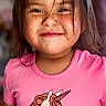 child, girl, smiling, portrait, close_up, face, happy, pink_shirt, unicorn, toddler, brown_hair, indoors, person, head, eyes, nose, mouth, casual_clothing, colorful, photography
