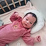 Lyana participe au concours pour gagner de l'argent avec cette photo : baby, infant, crib, blanket, pillow, pacifier, wooden_bars, clothing, soft_toys, bedroom, sleeping_area, person, portrait, indoor, cute, child, resting, pink_outfit, newborn, calm