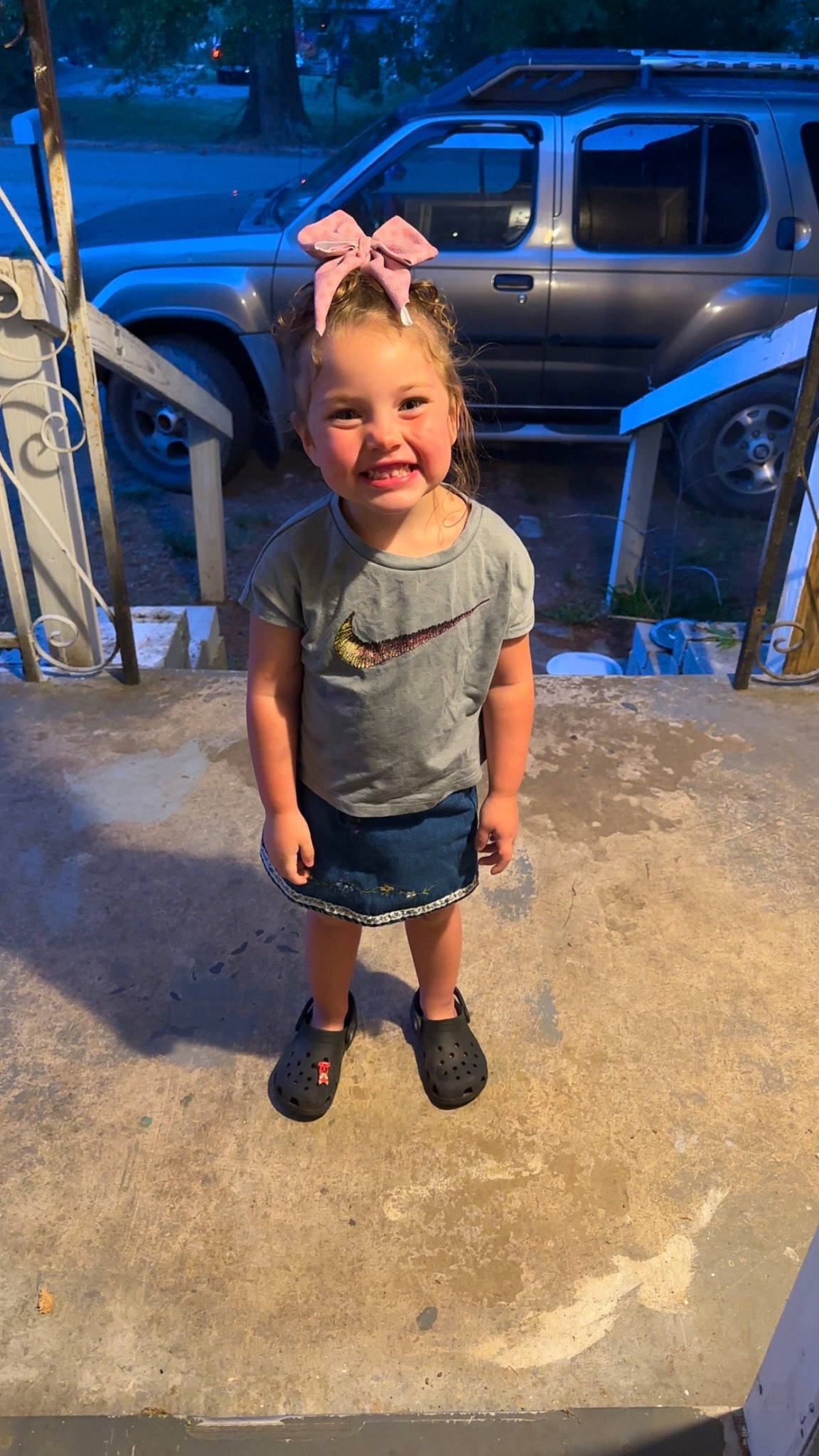 Ariyah joined the competition — help win amazing prizes! asphalt, automotive_design, automotive_exterior, automotive_lighting, automotive_tire, blue, bumper, car, electric_blue, fun, hood, joy, motor_vehicle, parking, person, smile, sunglasses, t_shirt, tire, toddler