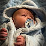Roman joined the competition — help win amazing prizes! baby, pacifier, robe, blanket, soft_texture, infant, hands, face, sleepwear, closeup, cute, child, newborn, warm, cozy, portrait, indoor, relaxed, small_hands, wrapped