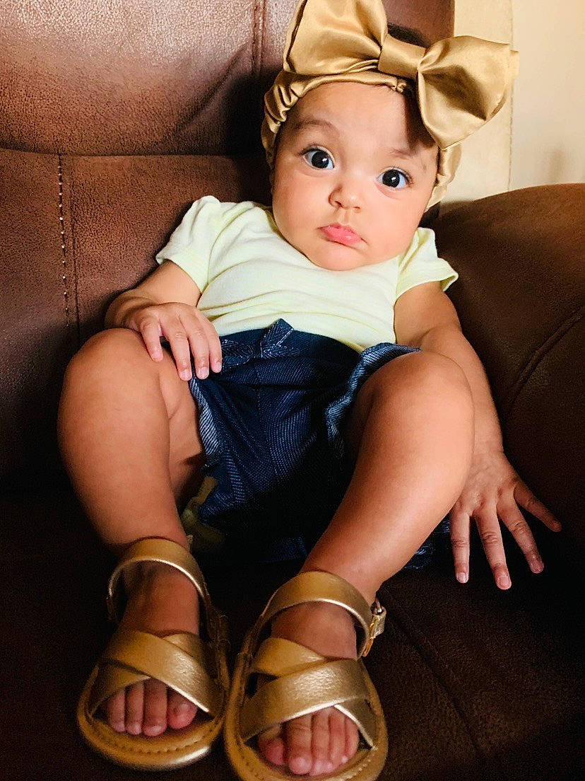 Nataly joined the competition — help win amazing prizes! arm, baby, blond, cheek, child, eye, foot, footwear, hand, hat, headgear, human_body, human_leg, joint, leg, person, shoe, sitting, skin, thigh