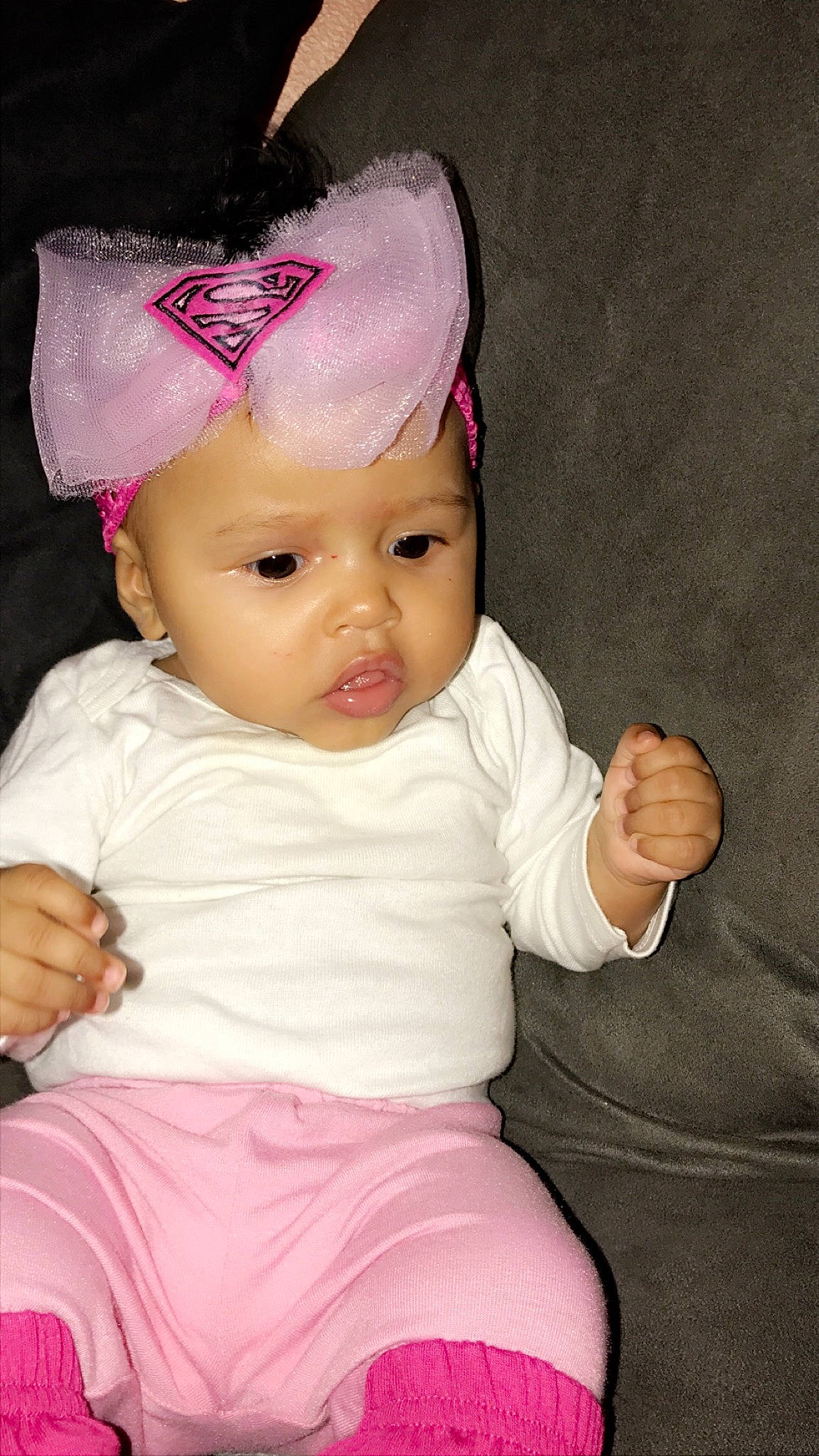 Jaylani is registered to the contest to win money with this photo: baby, baby_products, baby_toddler_clothing, cheek, child, ear, eye, hair_accessory, headgear, lip, person, pink, product, skin, smile, toddler