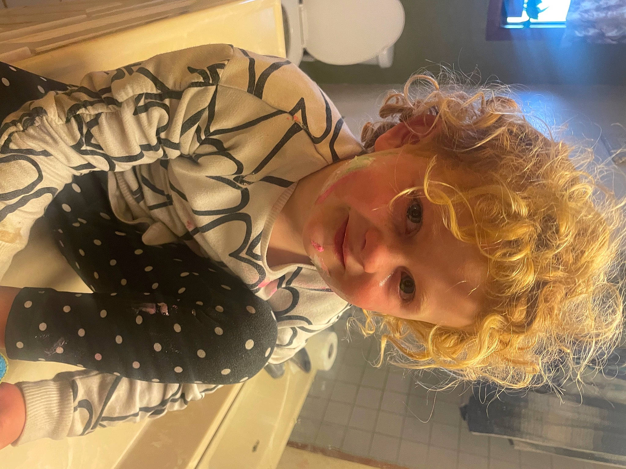 Paisley is registered to the contest to win money with this photo: child, comfort, cool, eyewear, flooring, fun, home_appliance, led_backlit_lcd_display, mouth, pattern, person, picture_frame, room, selfie, smile, television