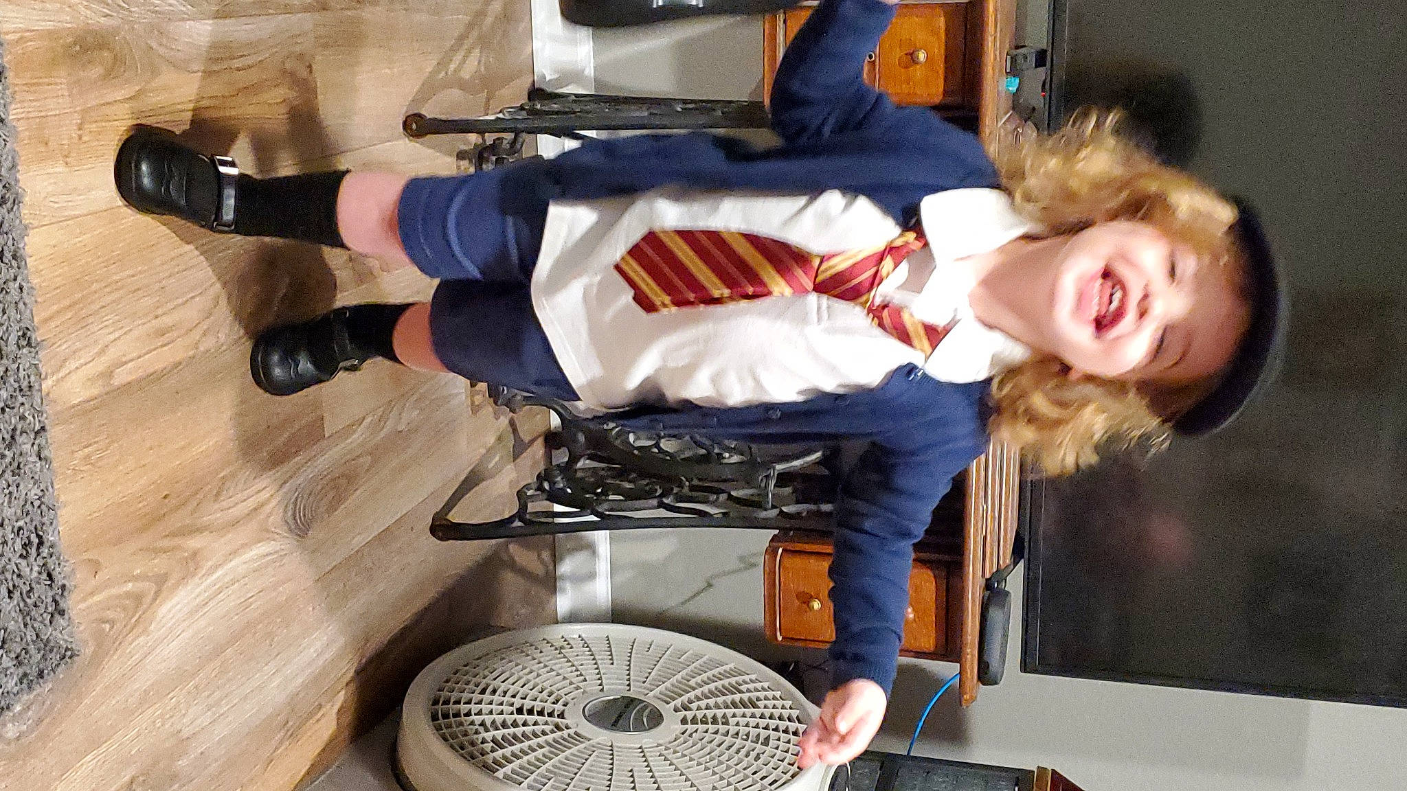 Noelle is registered to the contest to win money with this photo: arm, automotive_tire, boot, cooking, fun, gas, glove, hardwood, human_leg, joy, knee, machine, person, shoe, sneakers, sock, sports_gear, sports_uniform, sportswear, thigh