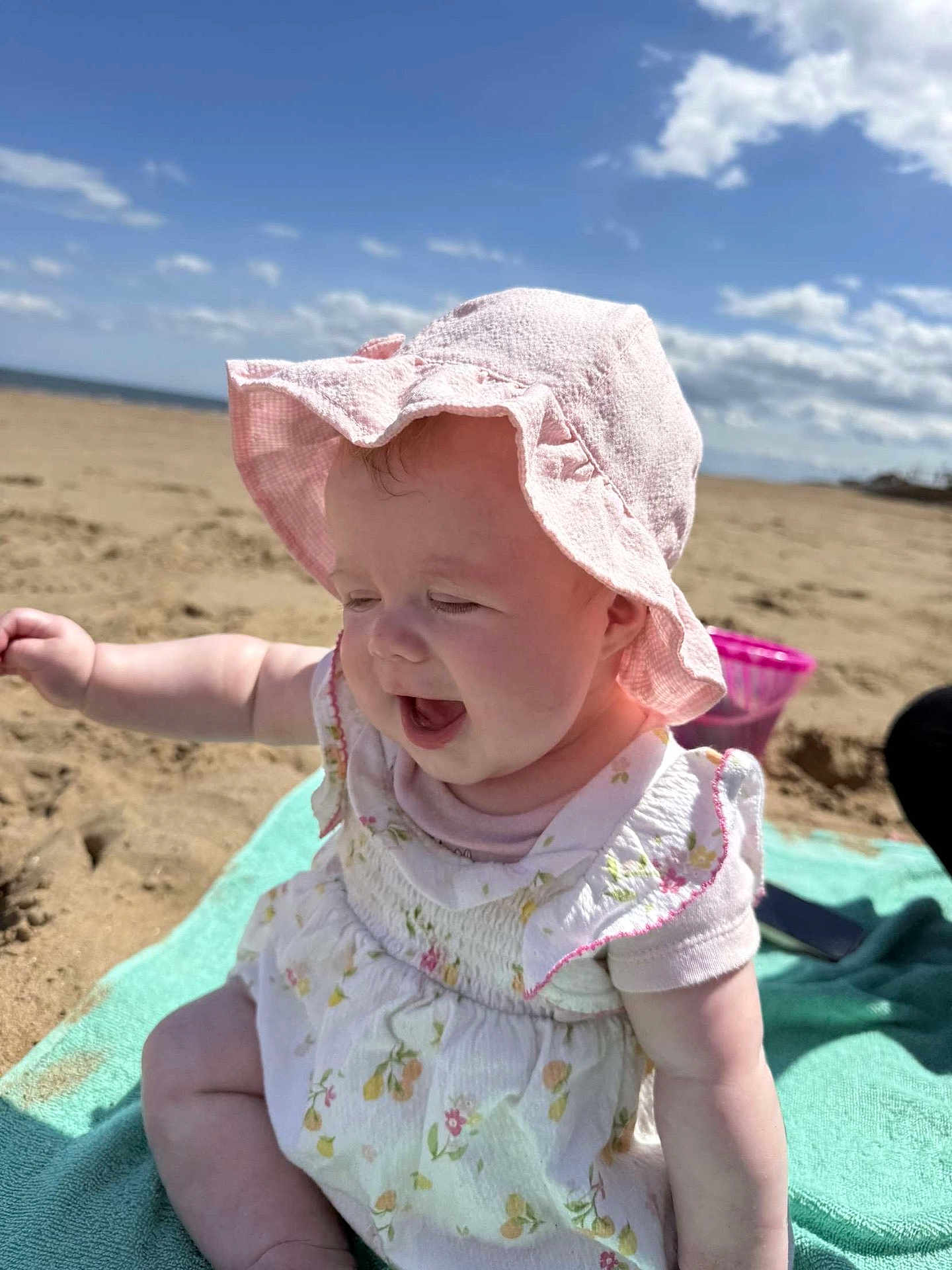 Myla-Mae joined the competition — help win amazing prizes! baby, child, beach, sunhat, towel, sand, sky, clouds, smiling, happy, summer, outdoor, cute, infant, clothing, sunny, playful, portrait, sitting, daylight