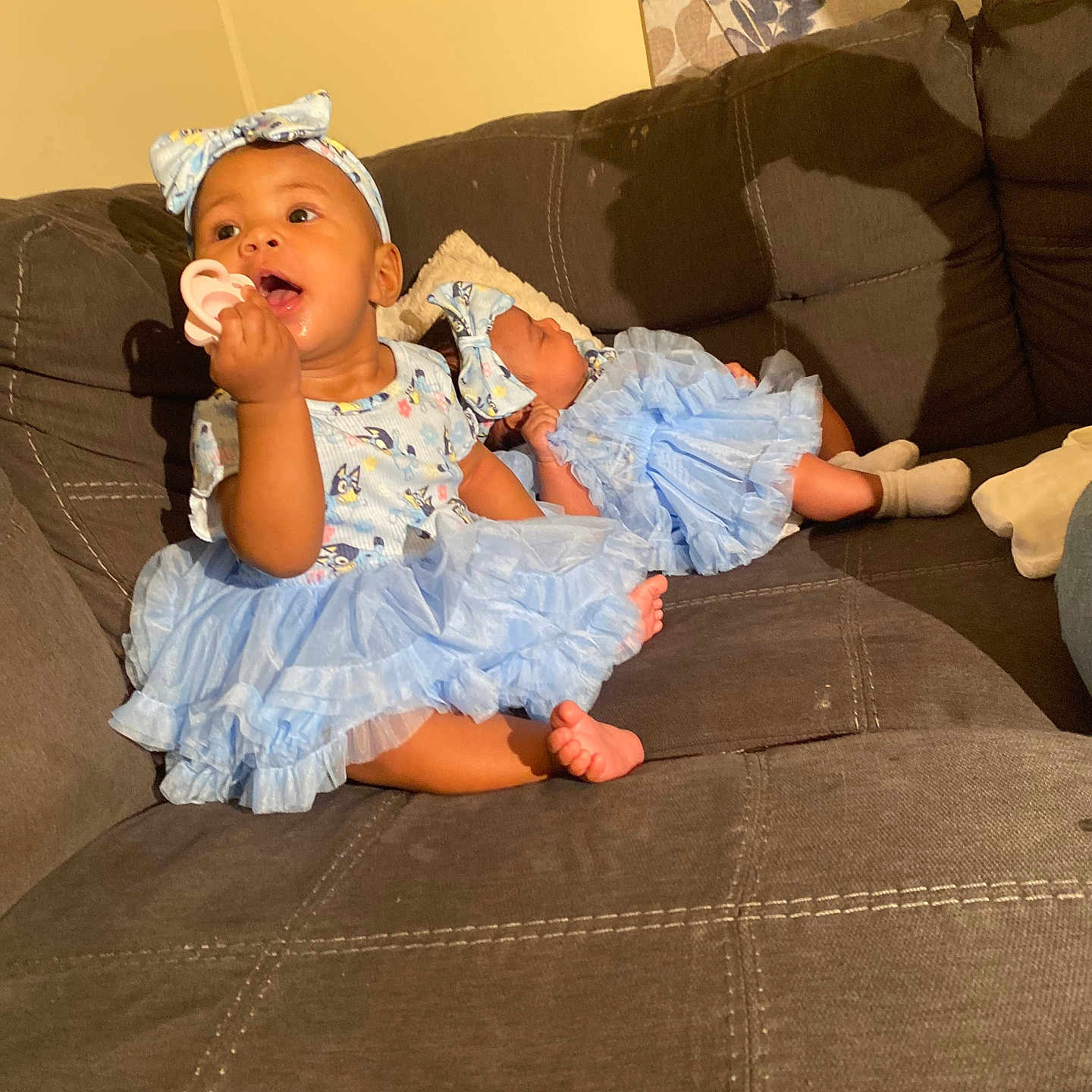 Nyari joined the competition — help win amazing prizes! architecture, baby, building, clothing, couch, cushion, dress, face, furniture, hat, head, homedecor, indoors, livingroom, pants, person, photography, portrait, room, sitting