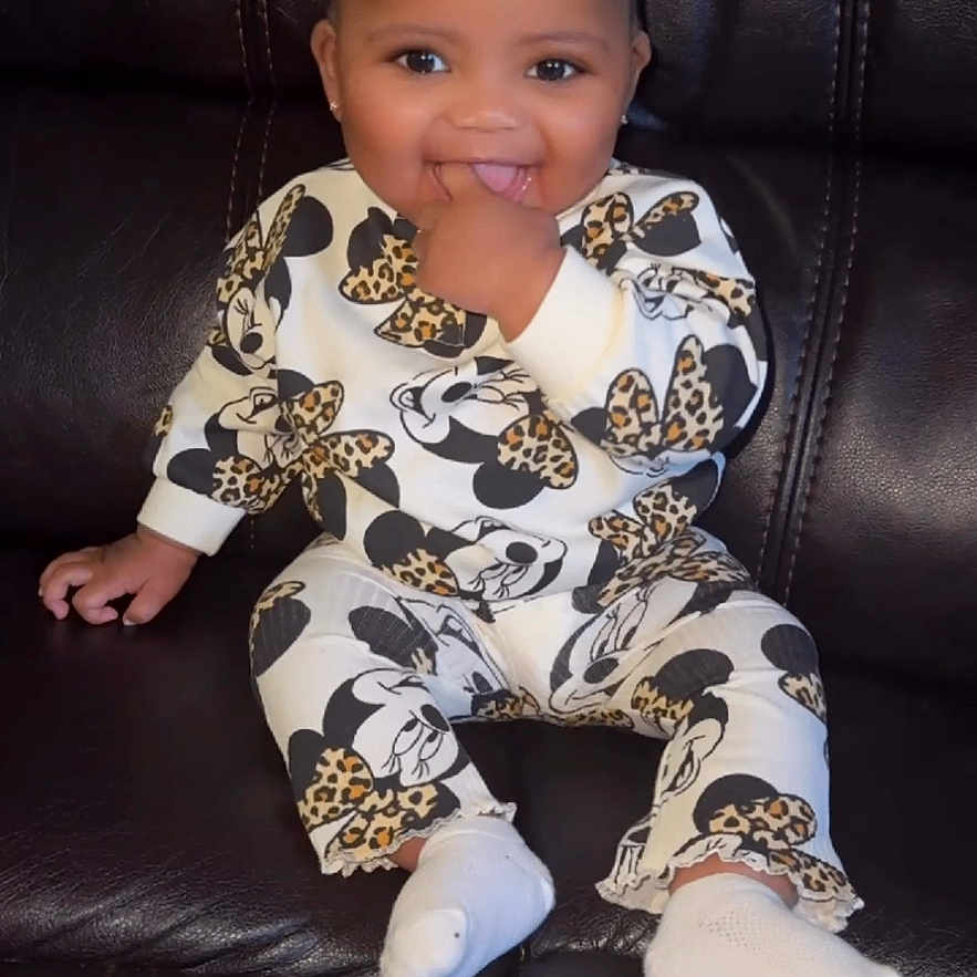 Diyani joined the competition — help win amazing prizes! baby, cheerful, child, couch, cute, dark_background, fashion, hand_in_mouth, happy, indoor, leather, minnie_mouse, outfit, patterned_clothing, portrait, sitting, small_person, smiling, white_socks, young_child