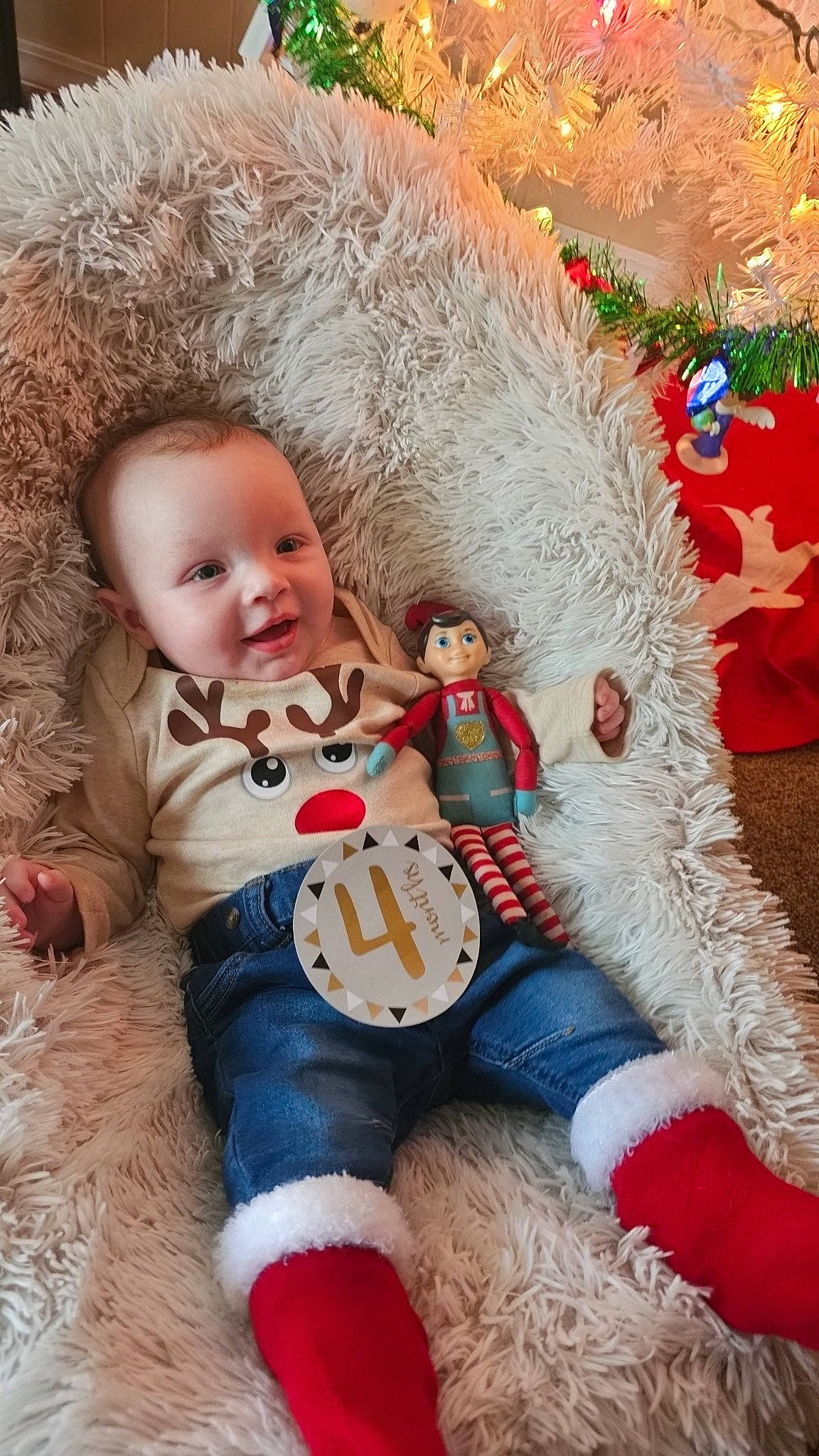 Atlas is registered to the contest to win money with this photo: art, baby, baby_toddler_clothing, child, christmas, christmas_eve, christmas_ornament, comfort, event, fur, happy, holiday, mammal, ornament, person, smile, textile, toddler, toy, vertebrate