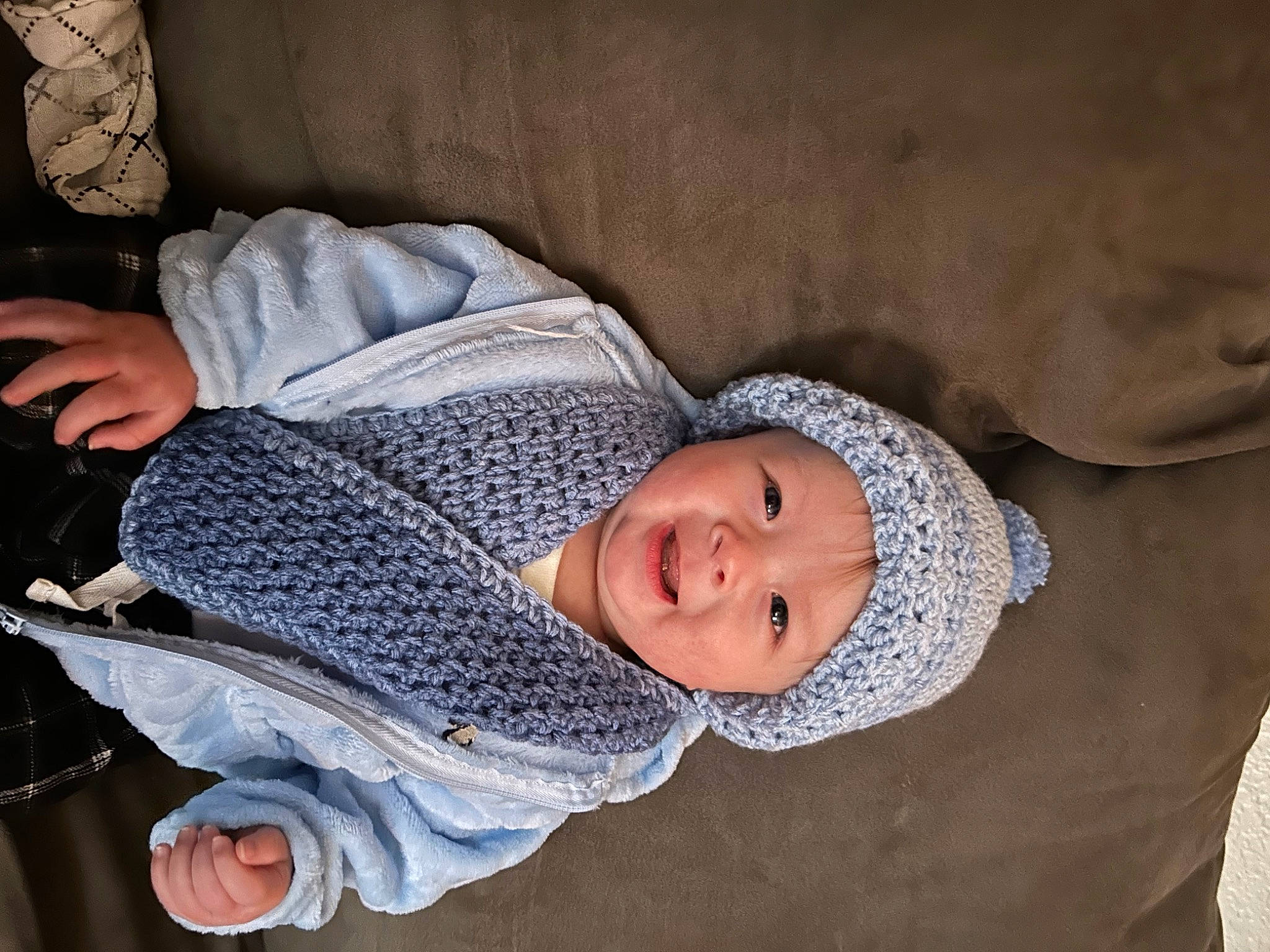 Kai is registered to the contest to win money with this photo: baby, baby_products, baby_toddler_clothing, child, comfort, flooring, headwear, linens, nap, pattern, person, room, sitting, sleep, sleeve, smile, textile, toddler, tree, wood