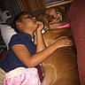 Asia Marie joined the competition — help win amazing prizes! arm, blanket, brown_dog, casual_clothing, child, close_up, couch, cozy, curtains, dog, furniture, home, indoor, peaceful, pet, pillow, pink_collar, resting, sleeping, snuggling