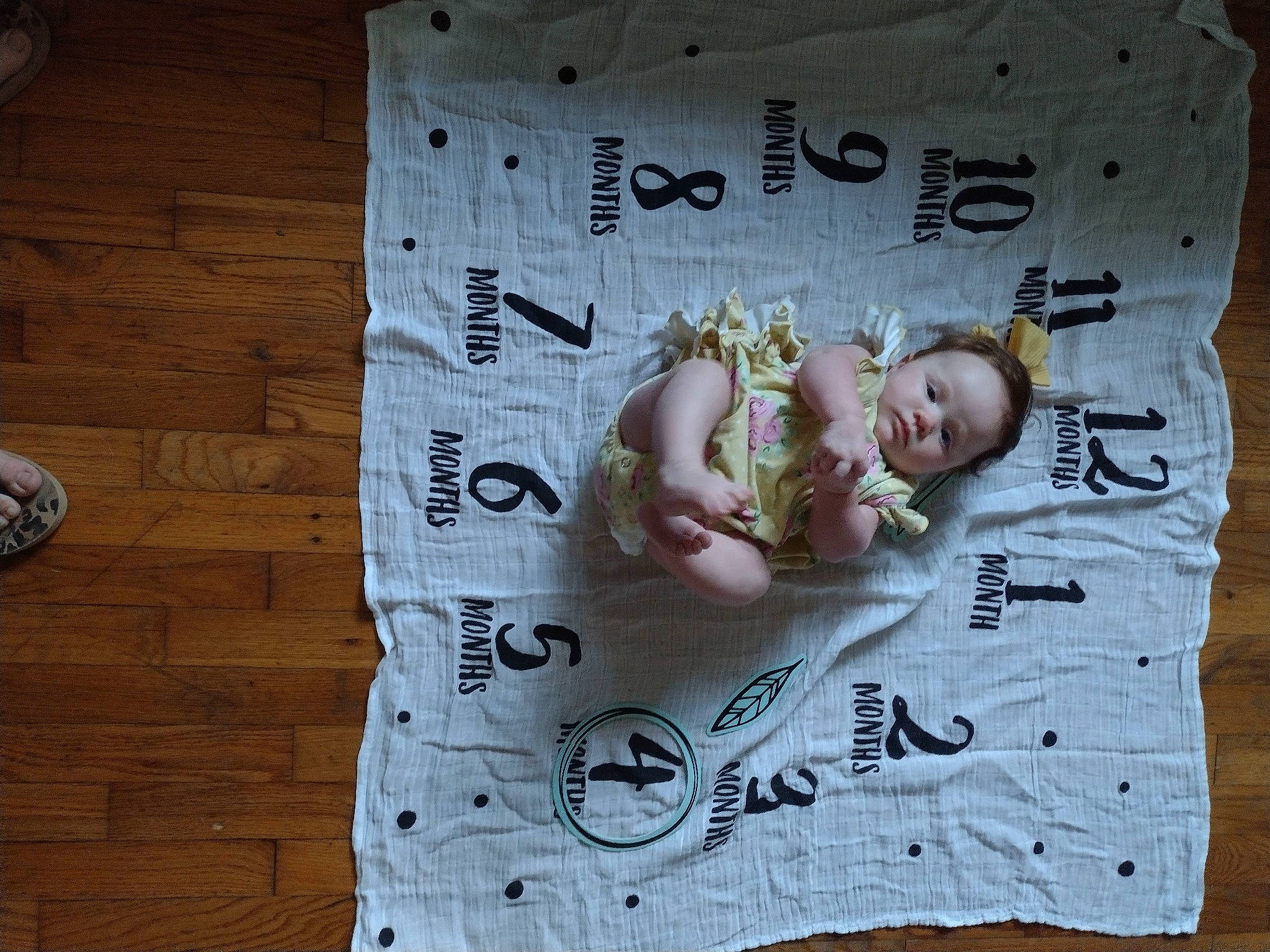 Jasmine is registered to the contest to win money with this photo: baby, baby_products, baby_toddler_clothing, child, flooring, font, happy, hardwood, head, linens, paper, pattern, person, pink, room, sleeve, t_shirt, toddler, wood, wood_flooring
