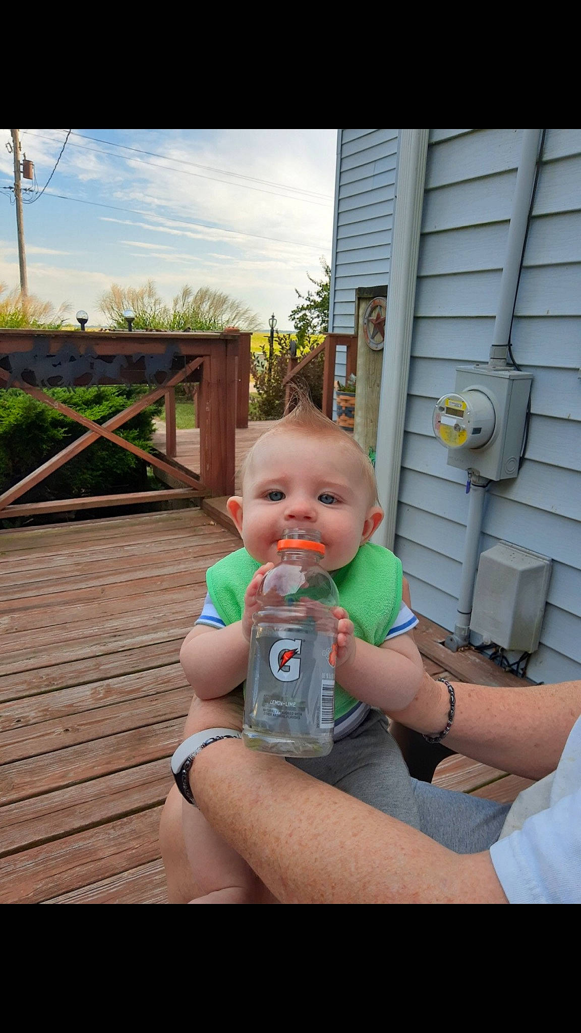 Hank joined the competition — help win amazing prizes! arm, baby, baby_bottle, baby_toddler_clothing, cloud, gesture, grass, hand, happy, human_body, leisure, person, plant, plastic_bottle, sitting, skin, sky, thigh, thumb, toddler