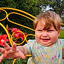 baby, child, smiling, reaching_hand, yellow_chair, flowers, red_flowers, greenery, outdoor, nature, grass, happy, cute, portrait, toddler, dress, short_sleeves, blond_hair, face, closeup