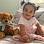 toddler, child, baby, smile, pigtails, bed, blanket, teddy_bear, plush_toy, indoors, soft_light, cute, happy, pink_clothing, person, foot, hand, cozy, curtain, window