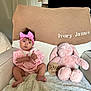 Ivory joined the competition — help win amazing prizes! baby, child, pink_bow, headband, stuffed_animal, pink_bunny, wooden_sign, three_months, blanket, armchair, cozy, indoor, cute, clothing, soft_toys, infant, home_decor, portrait, sitting, happy