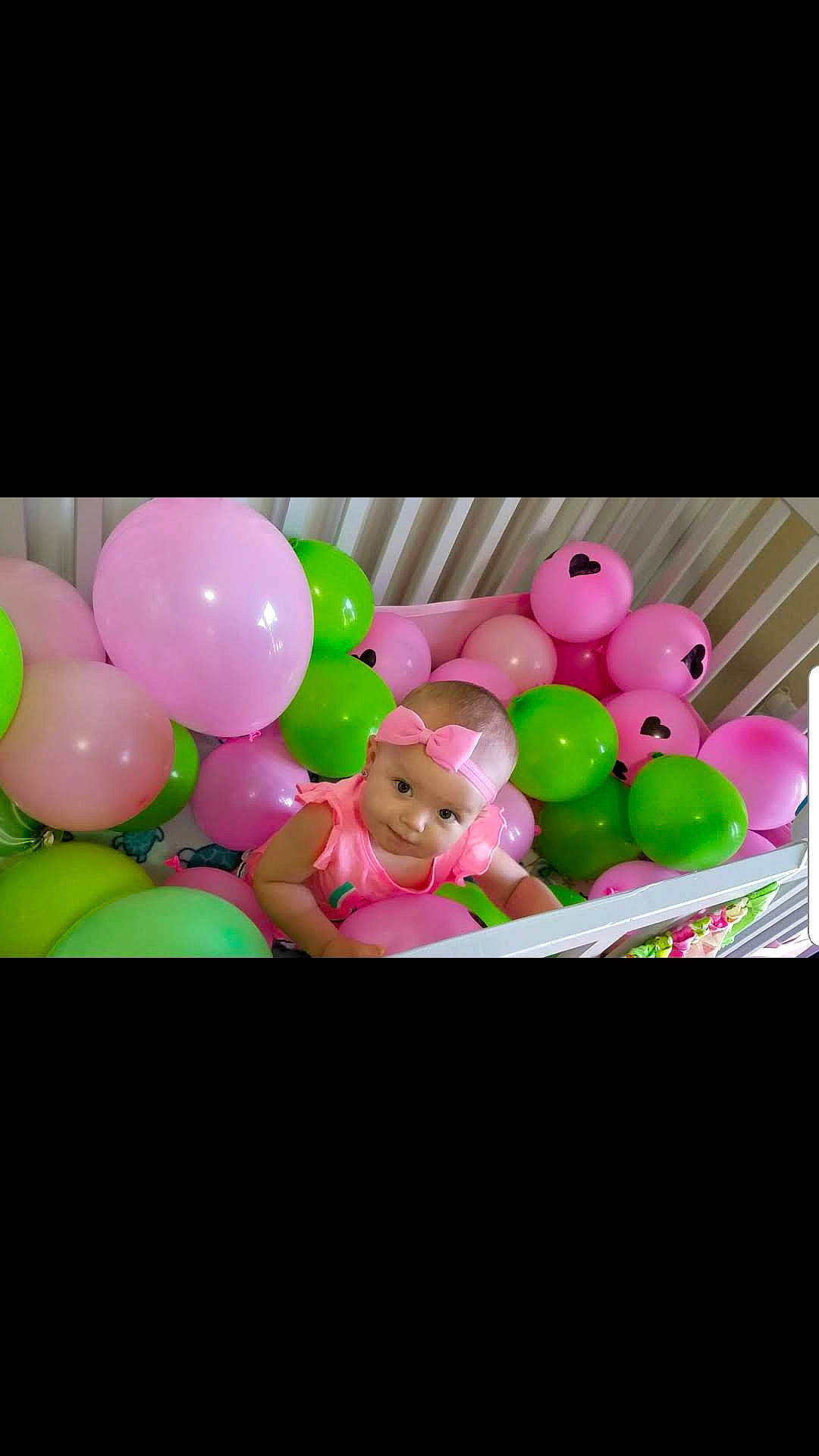 Madelynn is registered to the contest to win money with this photo: balloon, food, party, party_supply, person, pink, sweetness, toy