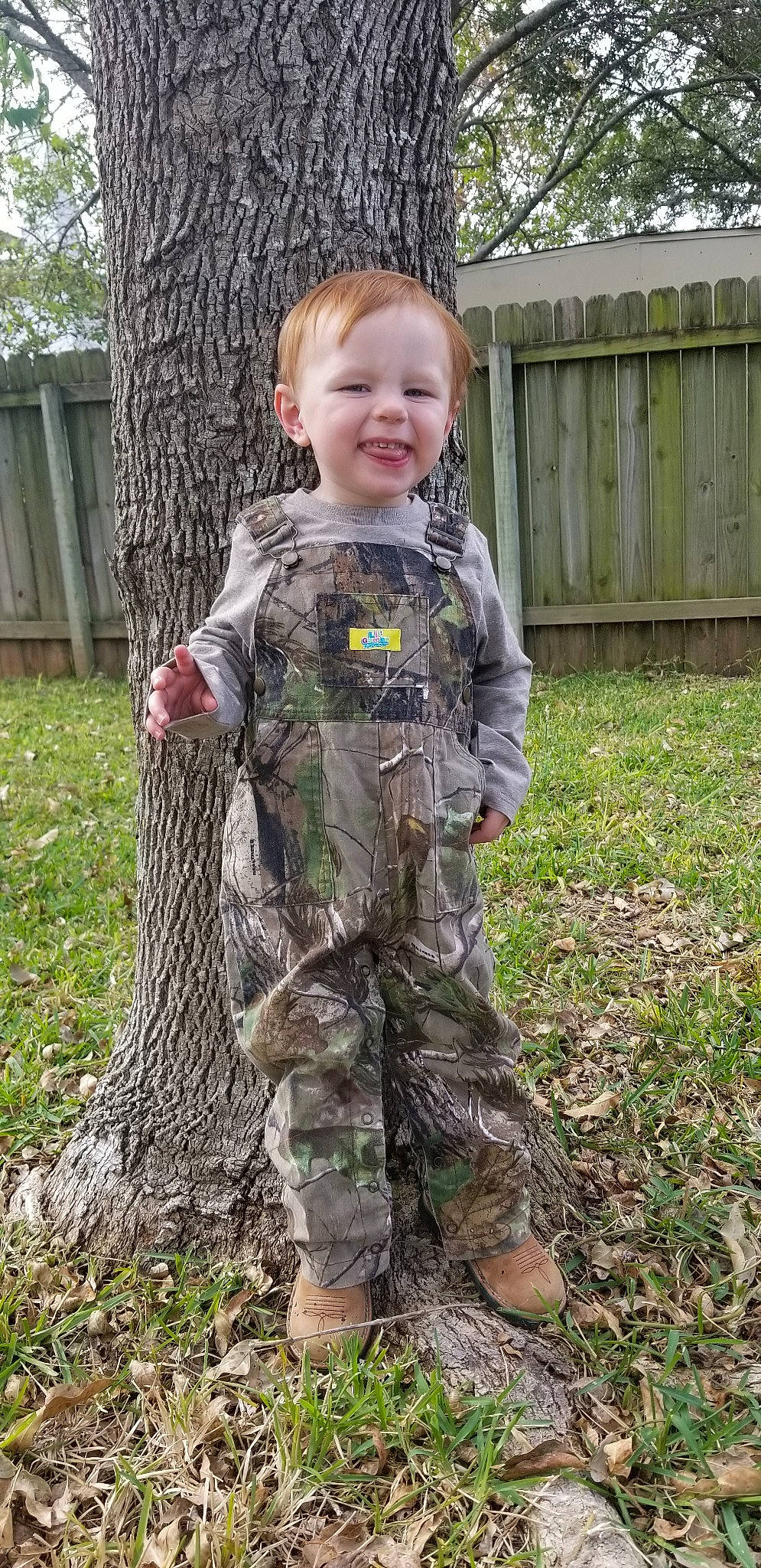 Cody is registered to the contest to win money with this photo: army, child, grass, hunting_clothing, joy, military, military_camouflage, military_uniform, person, plant, soldier, tree, woodland